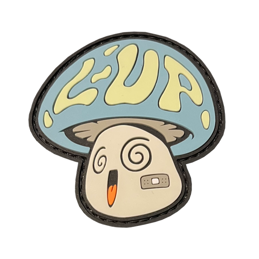 A mushroom character with the letters "L-UP" on the cap. Has swirly eyes, open smiling mouth, and a band-aid on its cheek. Cap is blue, L-UP is yellow, face is gray.