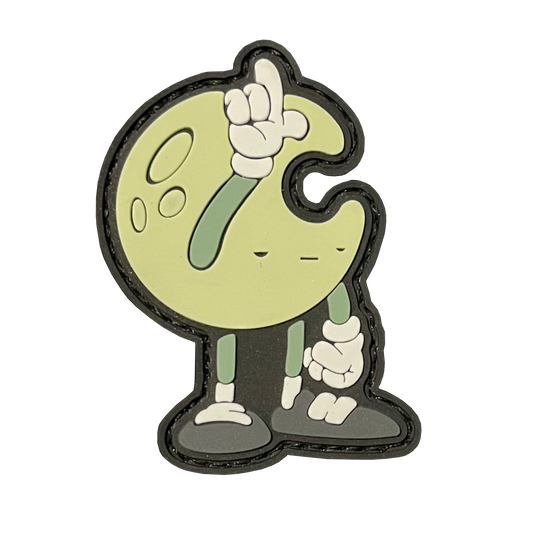 A crescent shaped moon character with an unamused face. Has arms and legs. One arm is sticking up, with his fingers forming an 'L' on his forehead. Primary color: green.