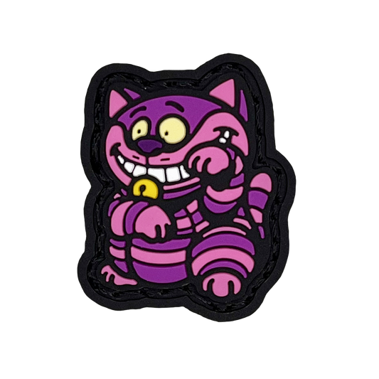 Cheshire Cat striking a 'lucky cat' (neko) pose for good fortune.