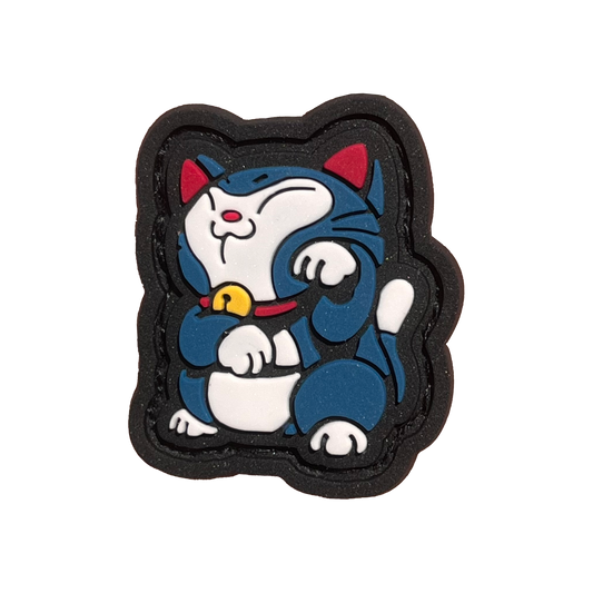 A blue and white cat with a red and yellow collar in the 'neko' position (lucky cat).