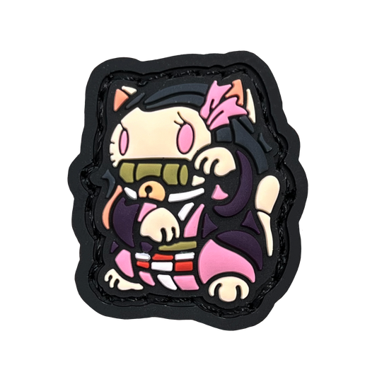 a small patch depicting nezuko of demon slayer in a lucky cat (neko) pose for good fortune.