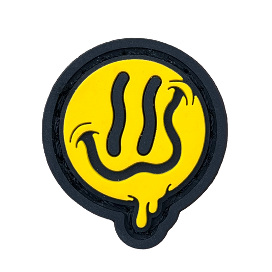 Yellow-colored smiling emoji with a broad, wavy smile and dripping effect.