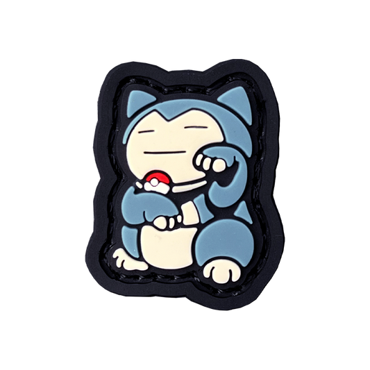 Snorlax in the neko (lucky cat) pose. Wearing a poke ball necklace.